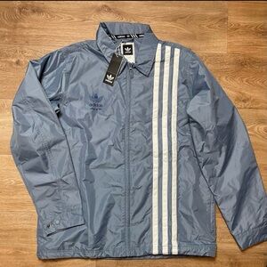 Adidas baby blue civilian jacket. Brand new Mens large, with tag.